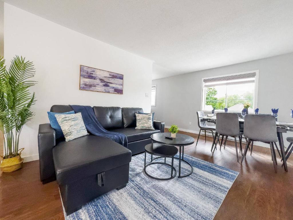 a living room with a couch and a table at Pet-Friendly Large 3-Bedroom - Bobcaygeon in Bobcaygeon