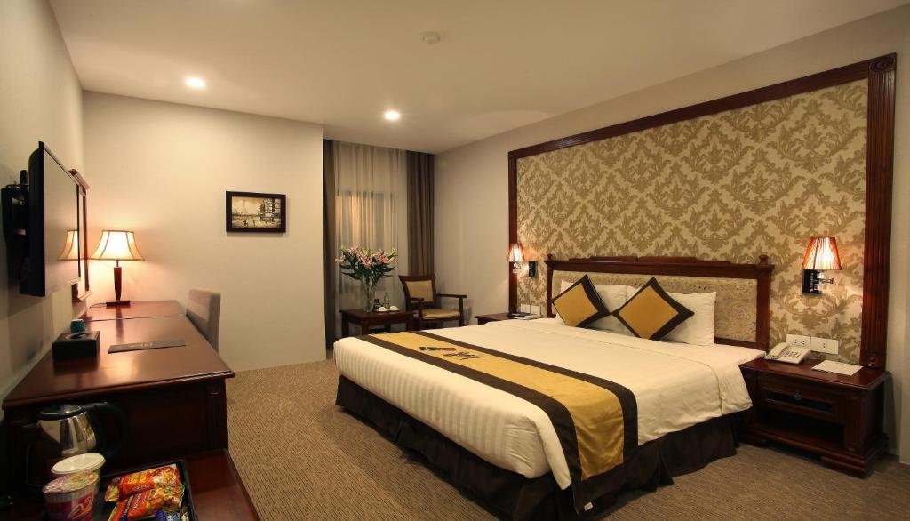 Postel nebo postele na pokoji v ubytování Western Hanoi Hotel