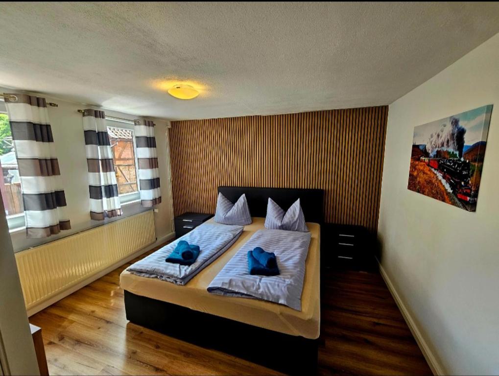 Postel nebo postele na pokoji v ubytování Ferienhaus zu den Ilsefällen