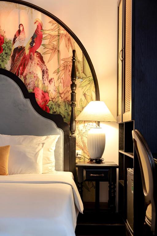 Postel nebo postele na pokoji v ubytování Hanoi Elpis Hotel & Spa