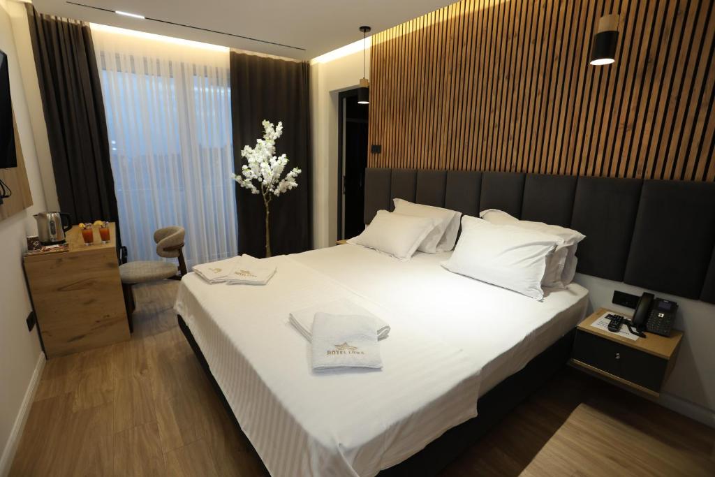 Postel nebo postele na pokoji v ubytování Hotel Luna