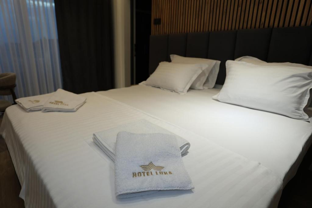 Postel nebo postele na pokoji v ubytování Hotel Luna