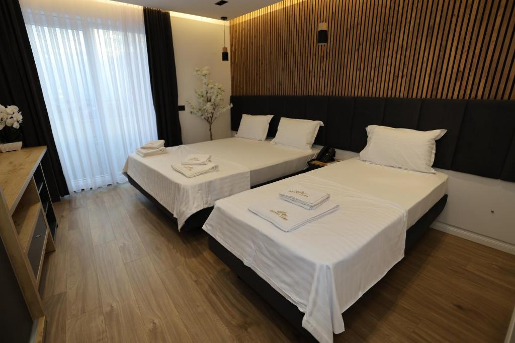 Postel nebo postele na pokoji v ubytování Hotel Luna