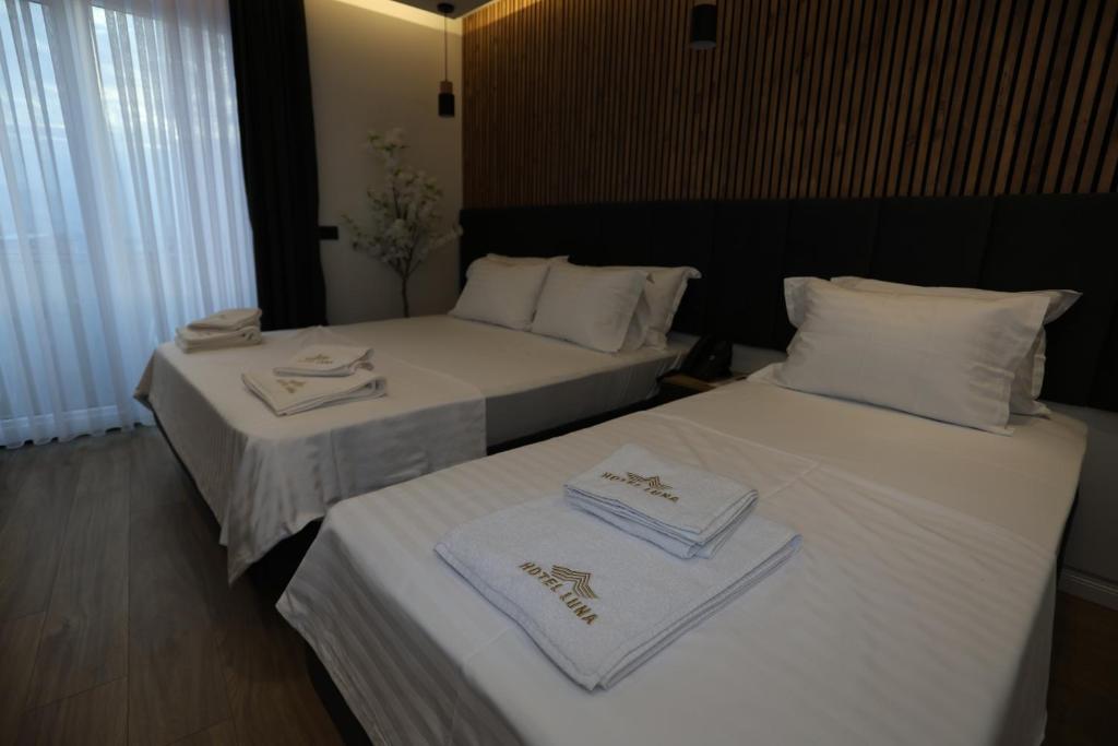 Postel nebo postele na pokoji v ubytování Hotel Luna