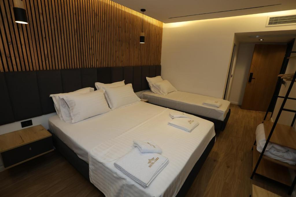 Postel nebo postele na pokoji v ubytování Hotel Luna