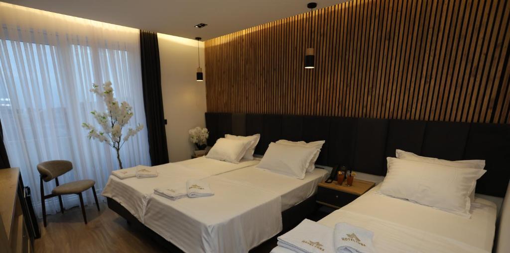 Postel nebo postele na pokoji v ubytování Hotel Luna