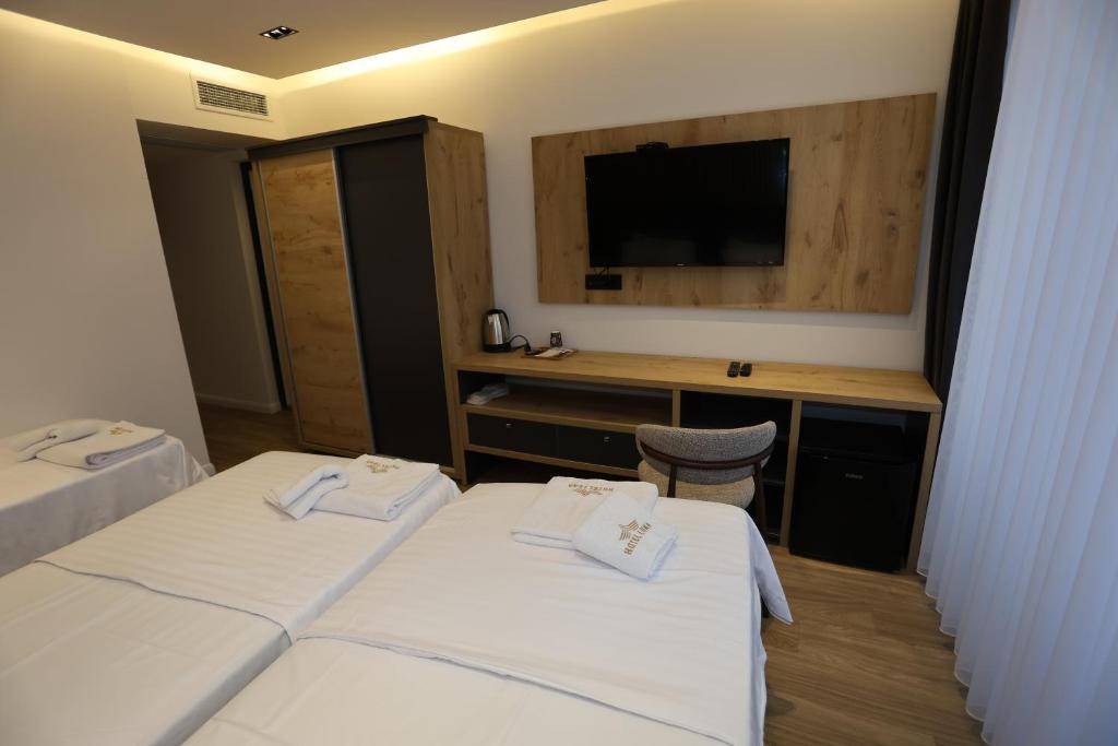 Postel nebo postele na pokoji v ubytování Hotel Luna