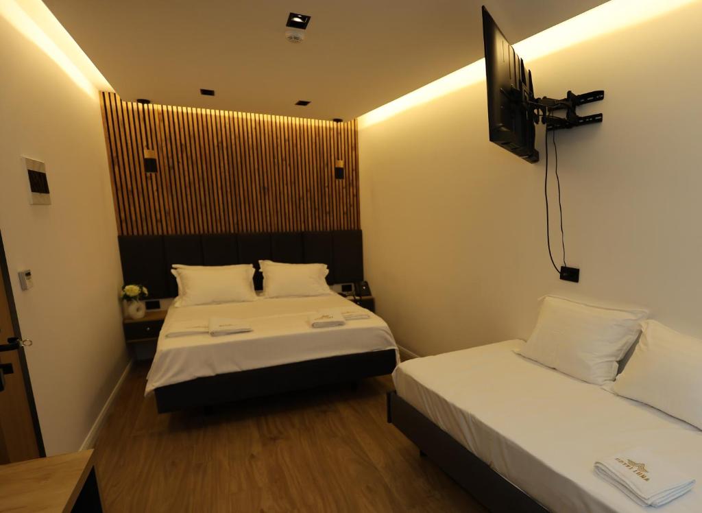 Postel nebo postele na pokoji v ubytování Hotel Luna
