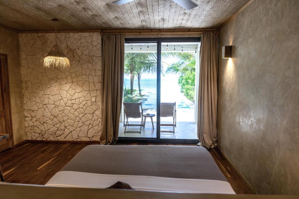 Tempat tidur dalam kamar di Passion Boutique Hotel Zanzibar - Adults Only