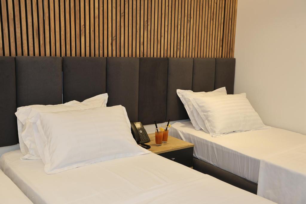 Postel nebo postele na pokoji v ubytování Hotel Luna