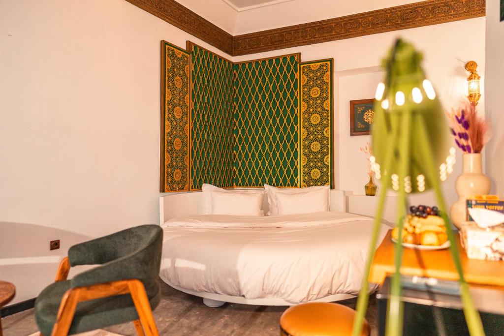 Postel nebo postele na pokoji v ubytování Riad L'ECOLE