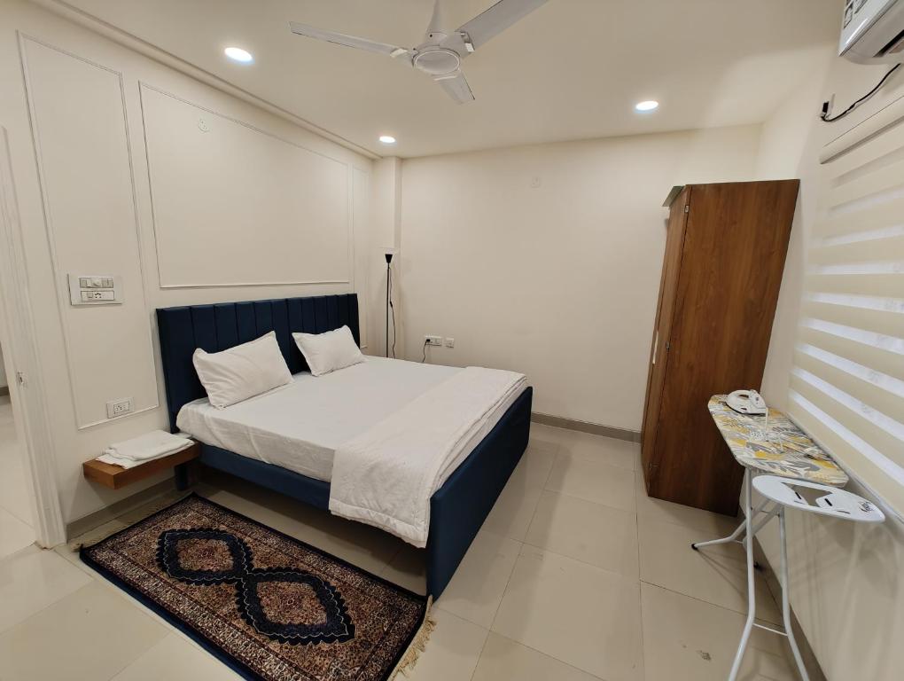 Ένα ή περισσότερα κρεβάτια σε δωμάτιο στο BS Homes - Serviced Apartments