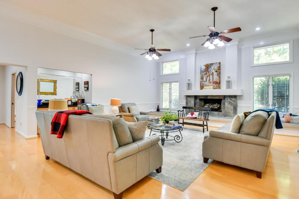 a living room with two couches and a fireplace at 4 Mi to UGA Pet-Friendly Home in Athens in Athens