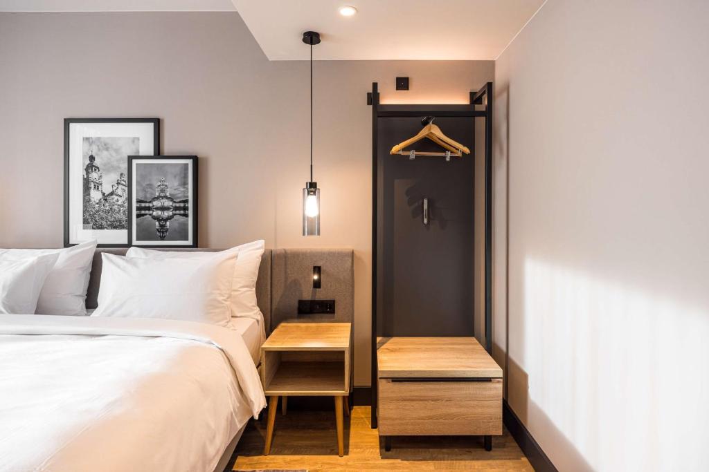 Postel nebo postele na pokoji v ubytování Radisson Hotel Leipzig