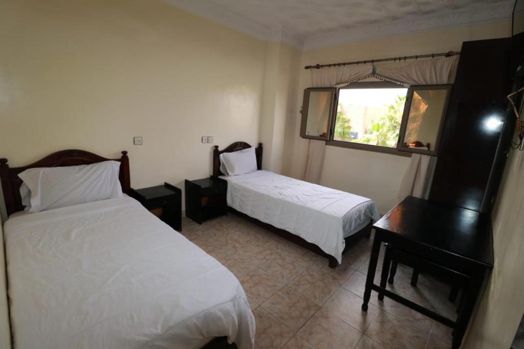 En eller flere senger på et rom på Hotel mekka sud