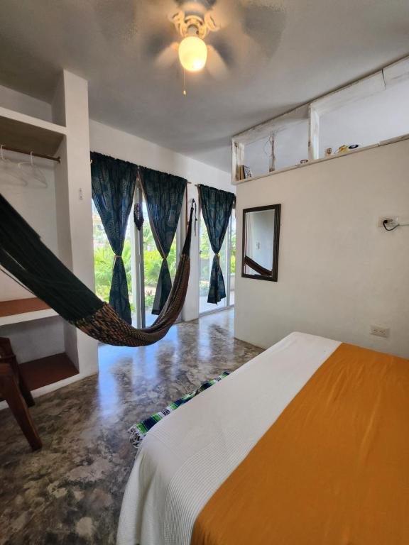 Postel nebo postele na pokoji v ubytování Villa Ixchel Tortugas