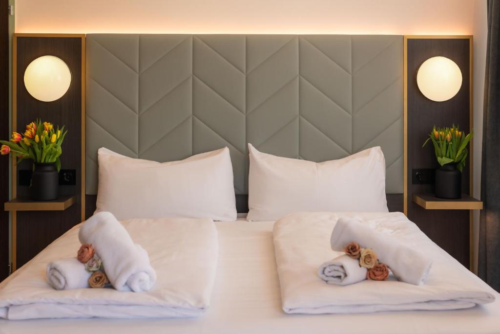 Postel nebo postele na pokoji v ubytování Florum Hotel