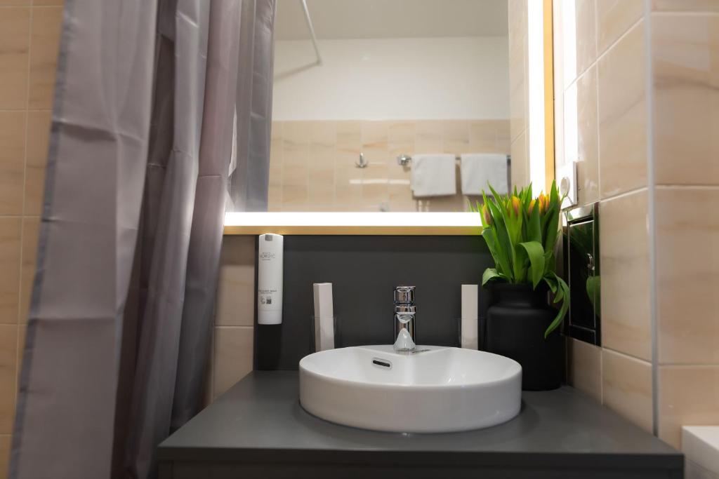 Koupelna v ubytování Florum Hotel