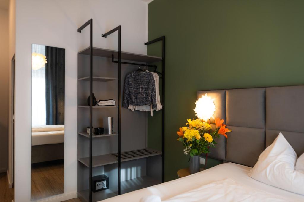 Postel nebo postele na pokoji v ubytování Florum Hotel