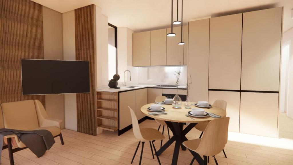 a kitchen and dining room with a table and chairs at Alpine glow - sophisticated ski in - ski out in Breuil-Cervinia