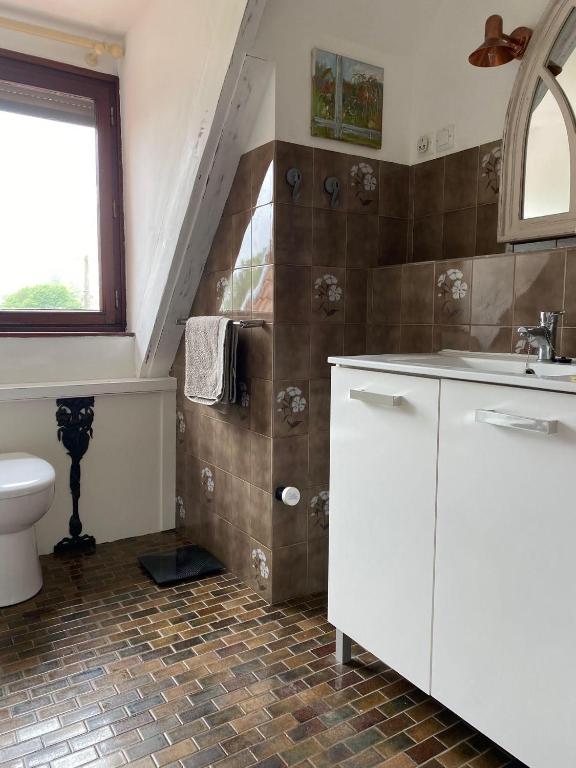 Koupelna v ubytování Chambre d'hôtes de Dompierre