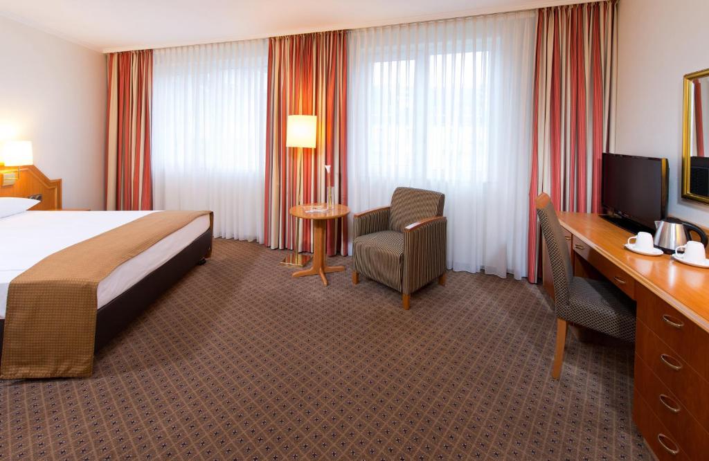 Ένα ή περισσότερα κρεβάτια σε δωμάτιο στο Leonardo Hotel Düsseldorf City Center