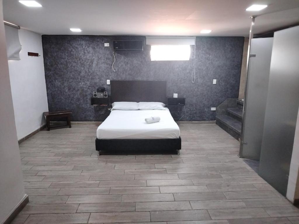 Postel nebo postele na pokoji v ubytování Hotel Medellin Park