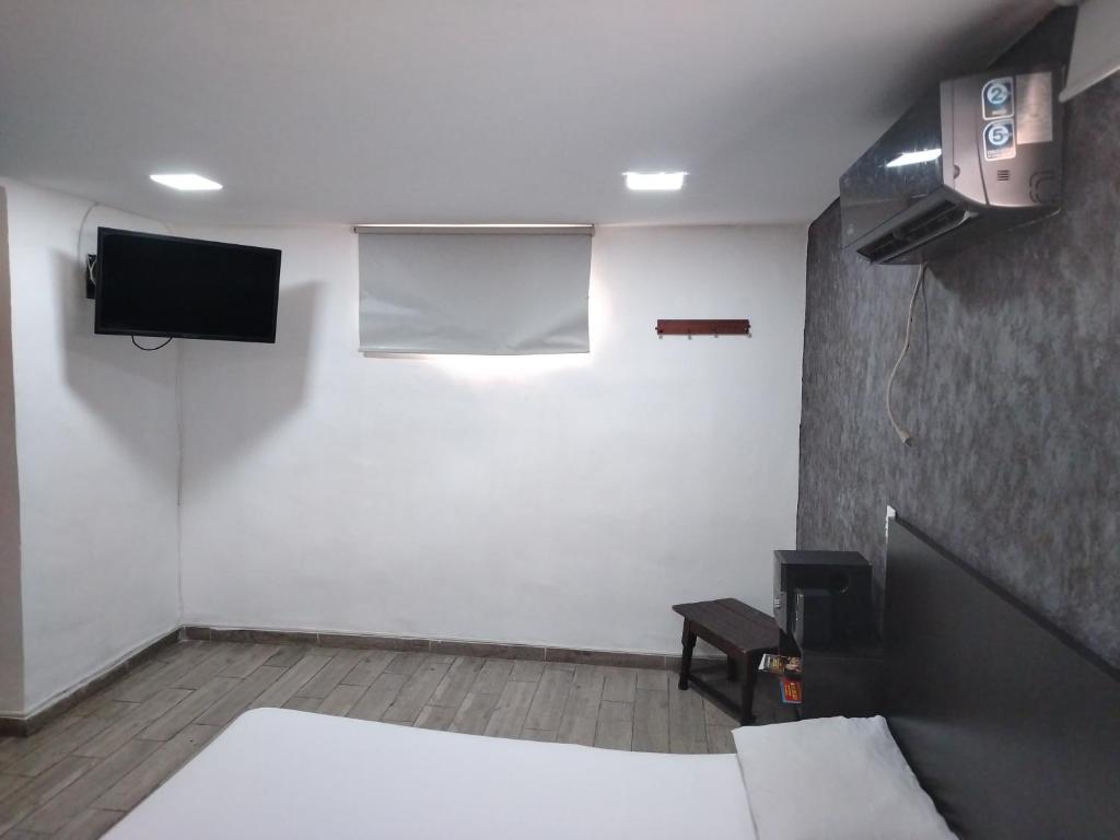 TV a/nebo společenská místnost v ubytování Hotel Medellin Park