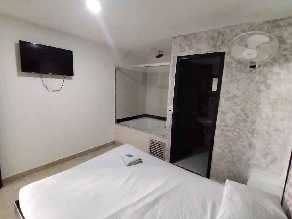 Postel nebo postele na pokoji v ubytování Hotel Medellin Park