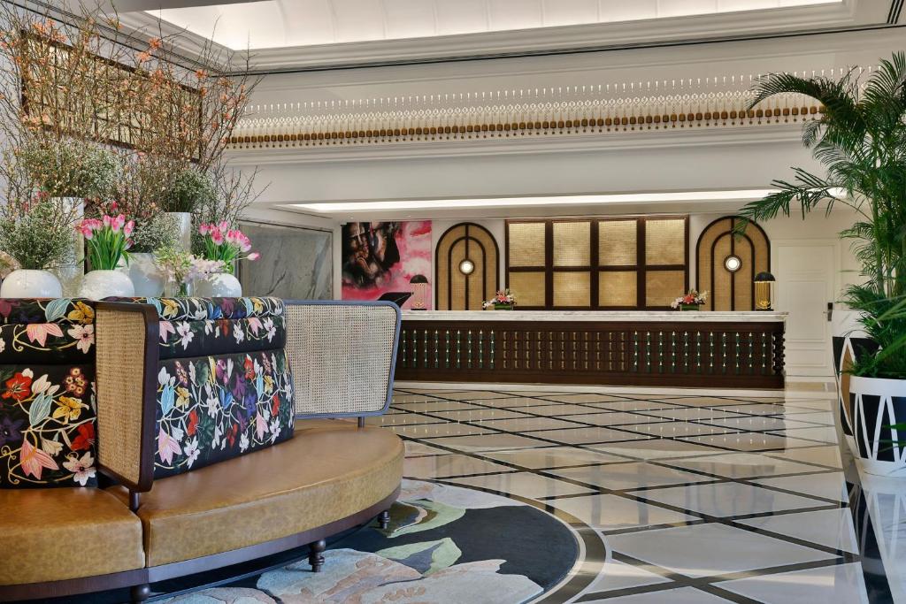 a lobby with a table and chairs in a building at The Westin Dubai Mina Seyahi Beach Resort and Waterpark in Dubai