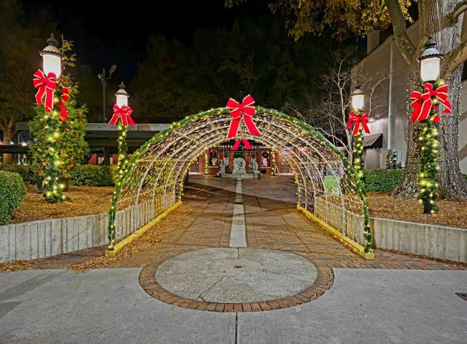 an archway with christmas lights and bows on it at Charming Retreat in the heart of Burlington in Burlington