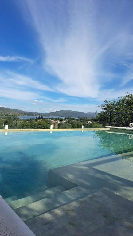 a large swimming pool with a clear blue water at Aldea Mate Amargo in Potrero de Garay
