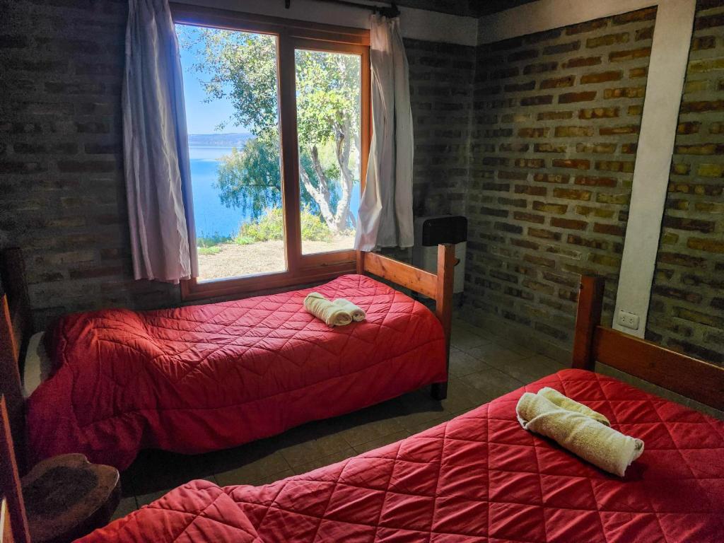 Postel nebo postele na pokoji v ubytování Costa de Lago - Cullelafquen