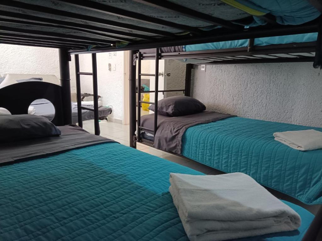 Ένα ή περισσότερα κρεβάτια σε δωμάτιο στο Casa Pok Ta Pok