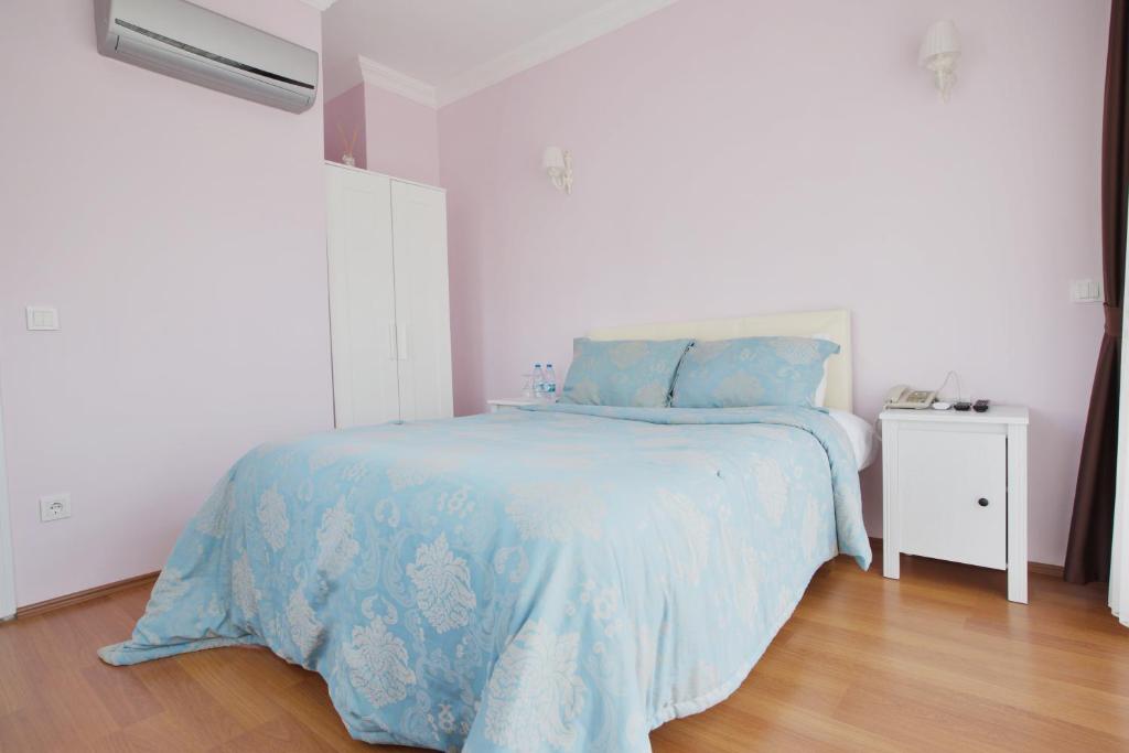 Postel nebo postele na pokoji v ubytování Nizam Butik Otel Büyükada