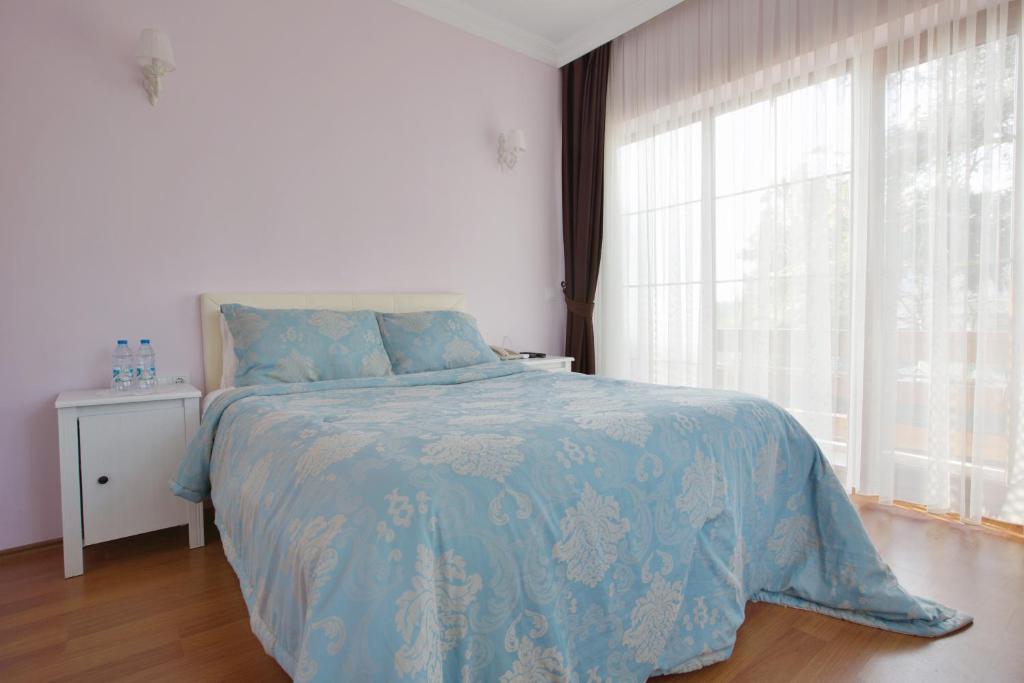 Postel nebo postele na pokoji v ubytování Nizam Butik Otel Büyükada