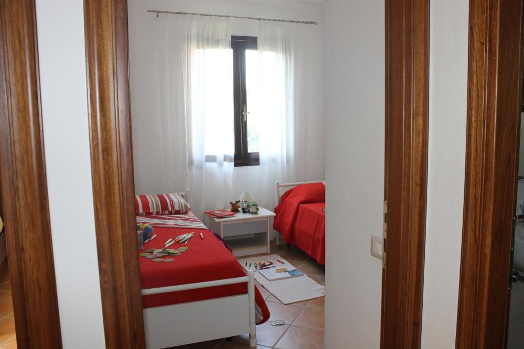 Łóżko lub łóżka w pokoju w obiekcie Casa Alessandra