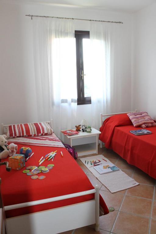 Łóżko lub łóżka w pokoju w obiekcie Casa Alessandra