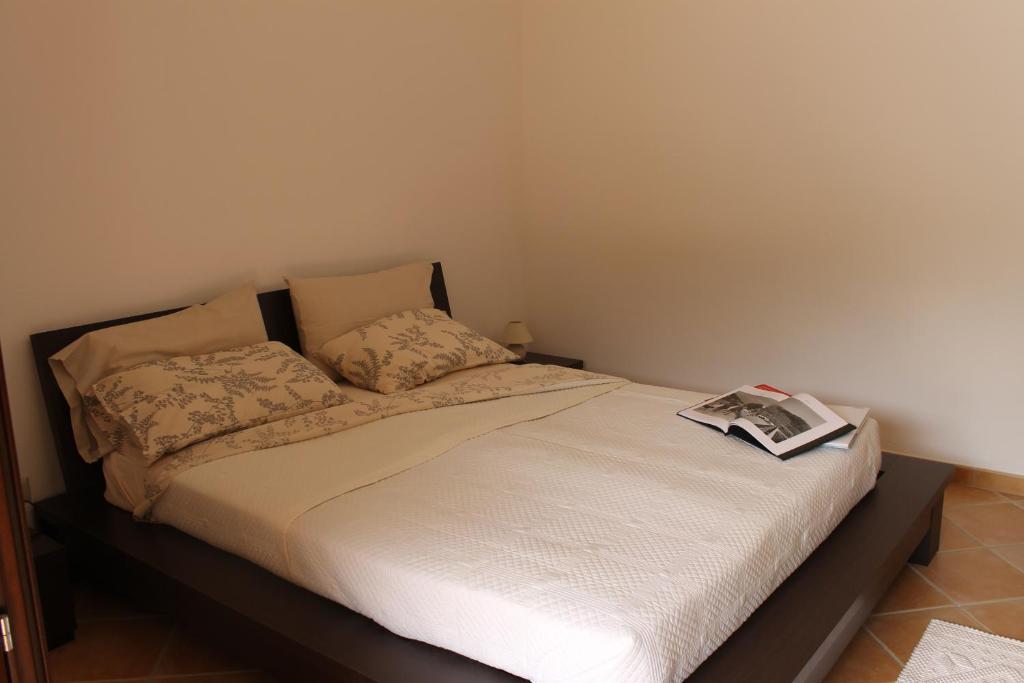 Łóżko lub łóżka w pokoju w obiekcie Casa Alessandra