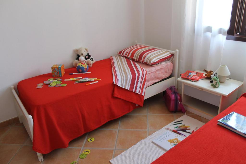 Łóżko lub łóżka w pokoju w obiekcie Casa Alessandra