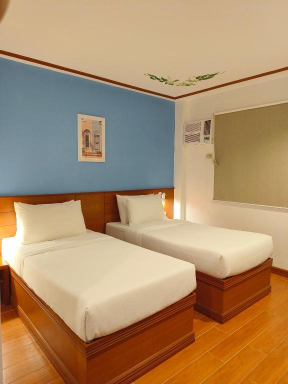 Postel nebo postele na pokoji v ubytování LaVie Hotel