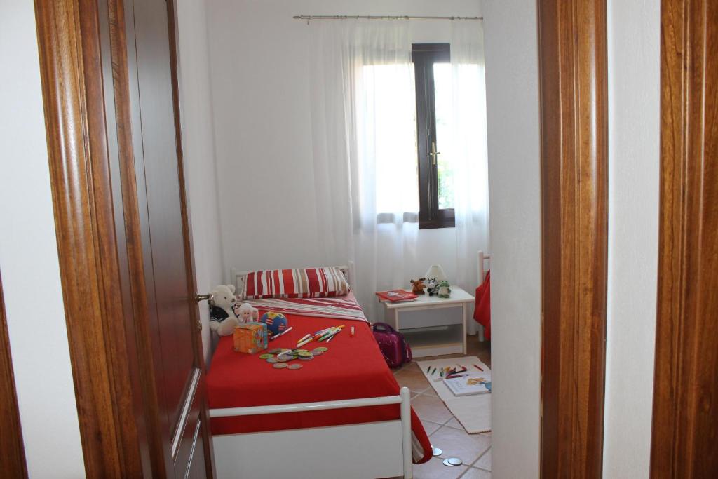 Łóżko lub łóżka w pokoju w obiekcie Casa Alessandra