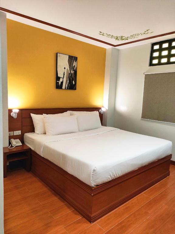 Postel nebo postele na pokoji v ubytování LaVie Hotel