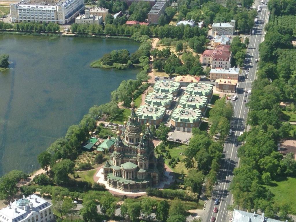 an aerial view of a house next to the water at New Peterhof Hotel in Petergof
