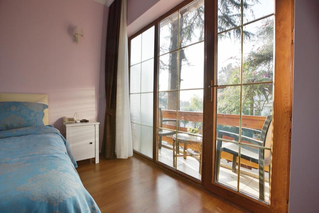 Postel nebo postele na pokoji v ubytování Nizam Butik Otel Büyükada