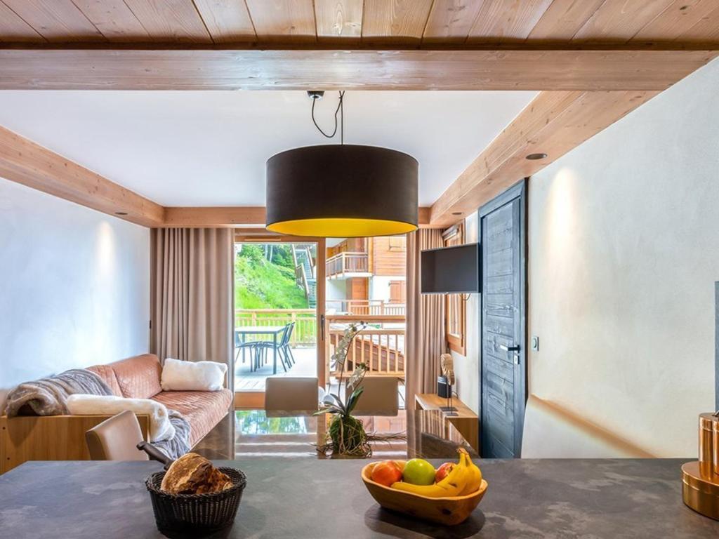 a room with a table with a bowl of fruit at Appartement de luxe aux Saisies avec SPA et parking pour 6 personnes - FR-1-810-16 in Les Saisies