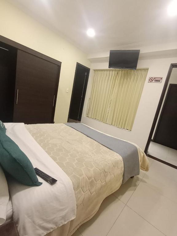 Postel nebo postele na pokoji v ubytování HOTEL El MONARCA