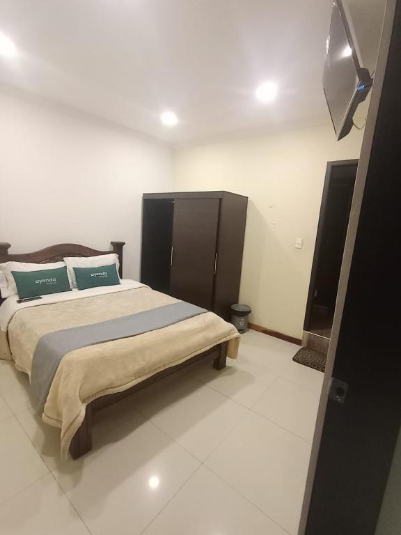Postel nebo postele na pokoji v ubytování HOTEL El MONARCA
