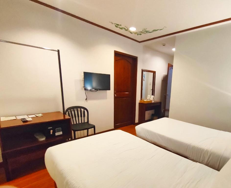 Postel nebo postele na pokoji v ubytování LaVie Hotel