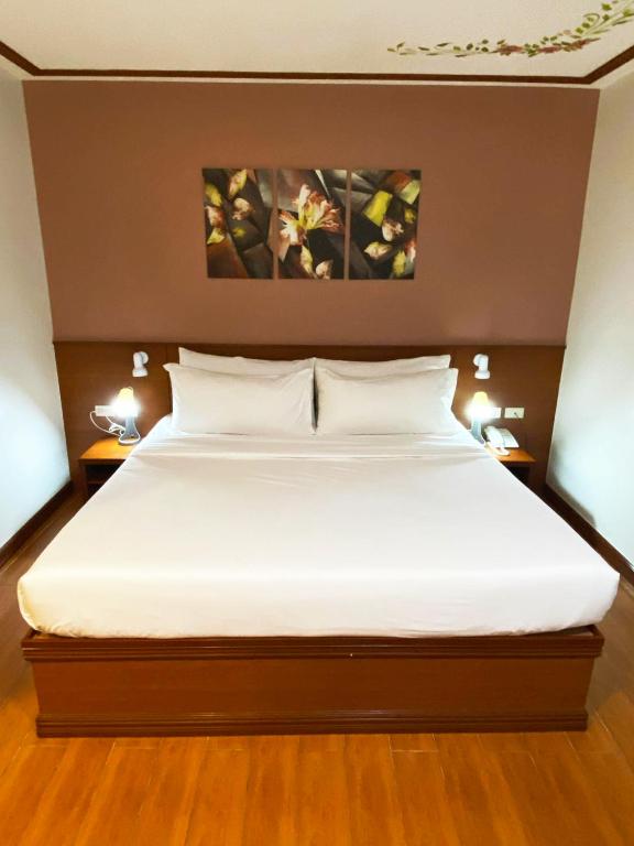 Postel nebo postele na pokoji v ubytování LaVie Hotel